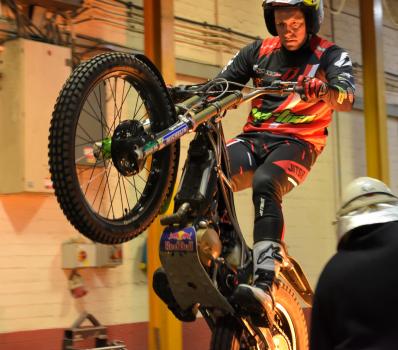 2) Concentration as Dougie Lampkin navigates molten metal being poured into moulds