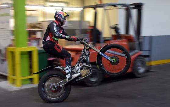 3) Dougie Lampkin pulls a wheelie as he speeds around the heat treatment works