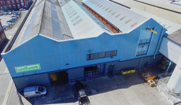 3) Recent drone view above part of one of the buildings in the complex