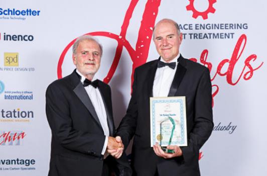 1) Richard Burslem (right) receiving the award from Alin Hick. (Image courtesy of Bandele Zuberi - high resolution images available to purchase http://clients.bandelezuberi.com/gallery/sea-awards-2018/)